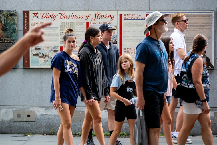 Visitors view panels on slavery at the President’s House in Independence National Historical Park.