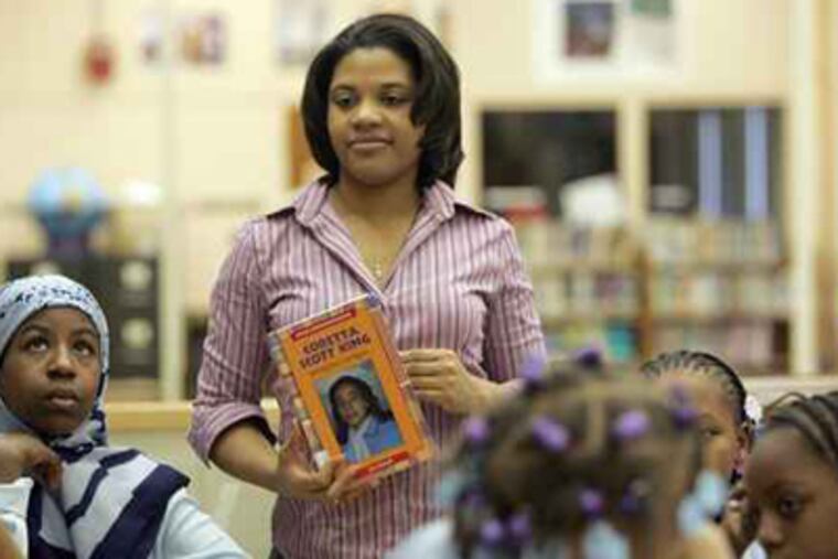Teacher Charlotte Gillum talks to students at Barratt Middle School in 2006. When G.W. Childs School students share the Barratt Middle School with about 90 Barratt eighth-graders this September, there will be separate entrances and staggered start and dismissal times. ( David Swanson / Inquirer File Photo)