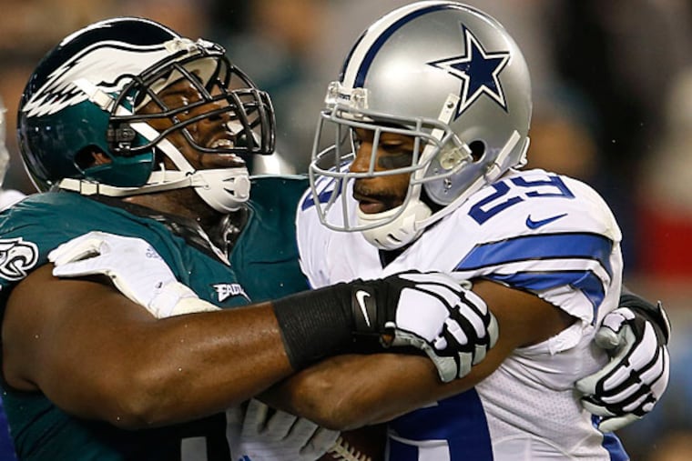 Eagles' Fletcher Cox stops Dallas Cowboys' DeMarco Murray in the
first-quarter on Sunday, December 14, 2014. (Yong Kim/Staff
Photographer)