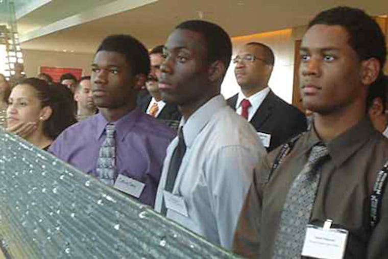 Participants in the mentoring program's anniversary celebration in the Comcast Center included (from left) Clarissa Velazquez, Craig Gay, Bryant Keal, and Steven Ferguson. The program is sponsored by the Greater Philadelphia Hispanic Chamber of Commerce. (Rodrigo Muzell / Staff Photographer)