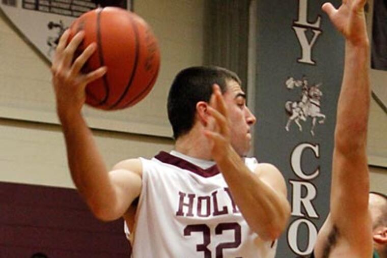 Holy Cross' Kyle Semmel makes a save in the first quarter against West Deptford. (Laurence Kesterson/Staff Photographer)