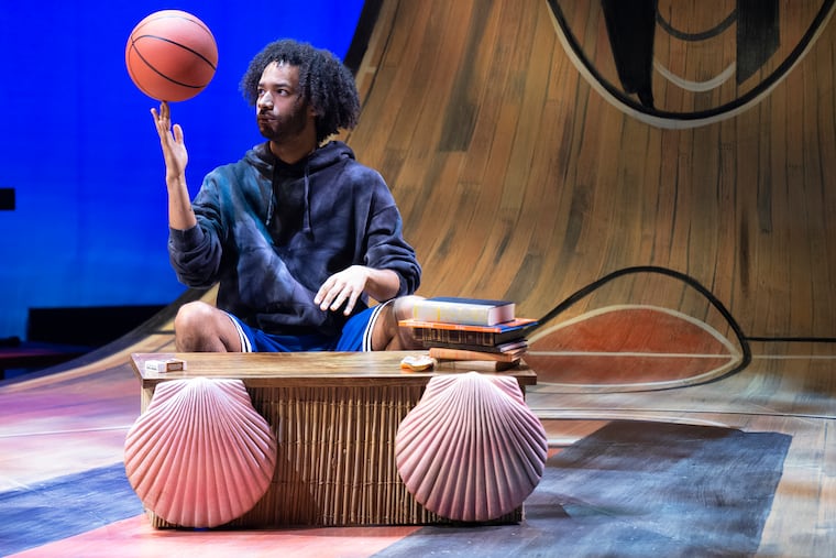 Actor Jordan Dobson, who plays a basketball player named Michael Jordan for a team on the island of Lilliput, rehearses on stage on Friday for the musical "Small Ball" at the Suzanne Roberts Theatre in Philadelphia.