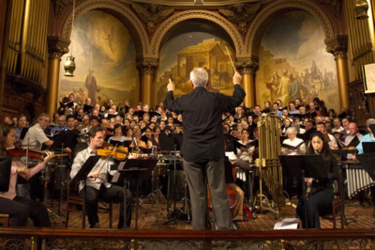 Alan Harler conducts the Chamber Orchestra of Philadelphia and the Pennsylvania Girlchoir in a rehearsal of Andrea Clearfield’s "Tse Go La" at Trinity Church. DAVID M WARREN / Staff Photographer