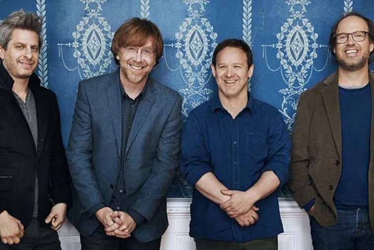 Mike Gordon, Trey Anastasio , Jon Fishman, and Page McConnell - otherwise known as Phish - have an ardent fan base that they know how to please, as they did at the Mann on Tuesday. The songs can be long, the rituals familiar.