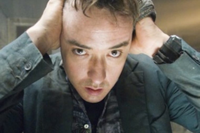 John Cusack plays travel writer Mike Enslin in Mikael Håfström's "1408," a movie based on a Stephen King short story.