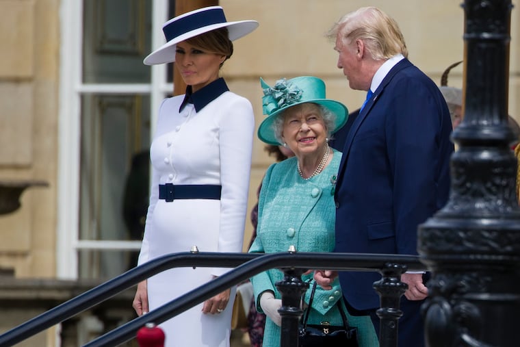 First lady Melania Trump (left) stands as Queen Elizabeth II smiles while talking with President Donald Trump at Buckingham Palace on Monday.