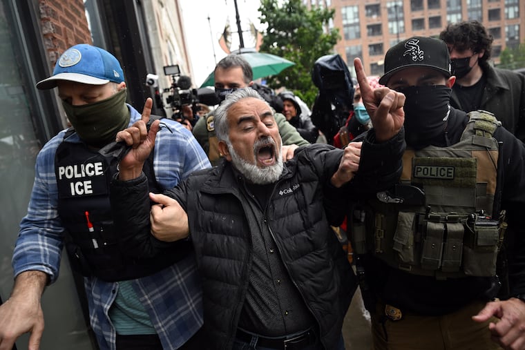 Federal immigration agents detains a man in Chicago this summer: ICE agents have arrested thousands of immigrants and clashed with protesters across the U.S.