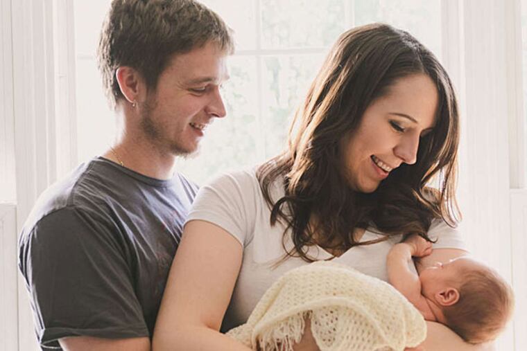 Logan Lester Faust with his parents, Daryl Faust and Courtney Schmidt. (Trinity Walker/ SummerHouse Photography)
