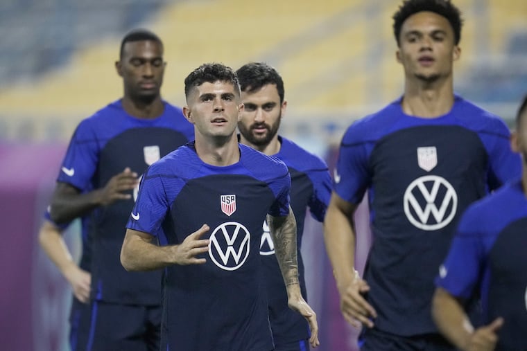 United States forward Christian Pulisic, center, and other players participate in an official training session at Al-Gharafa SC Stadium, in Doha, Saturday, Nov. 19, 2022. (AP Photo/Ashley Landis)