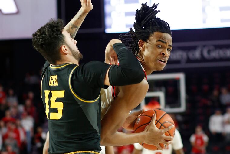 Georgia forward Nicolas Claxton (33) tries to get by Missouri guard Jordan Geist (15) during the first half of an NCAA college basketball game Wednesday, March 6, 2019, in Athens, Ga. (Joshua L. Jones/Athens Banner-Herald via AP)