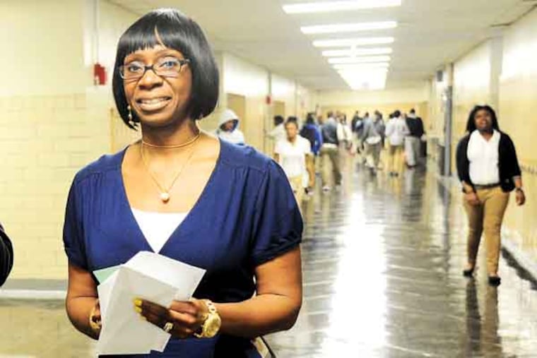 LaTrina Stewart, 43, former master teacher and currently the assistant principal at Robert Vaux High School walks the hallways during a class change April 9, 2013. Stewart is part of the first class of PhillyPLUS, a district program designed to help classroom teachers become principals. ( CLEM MURRAY / Staff Photographer )