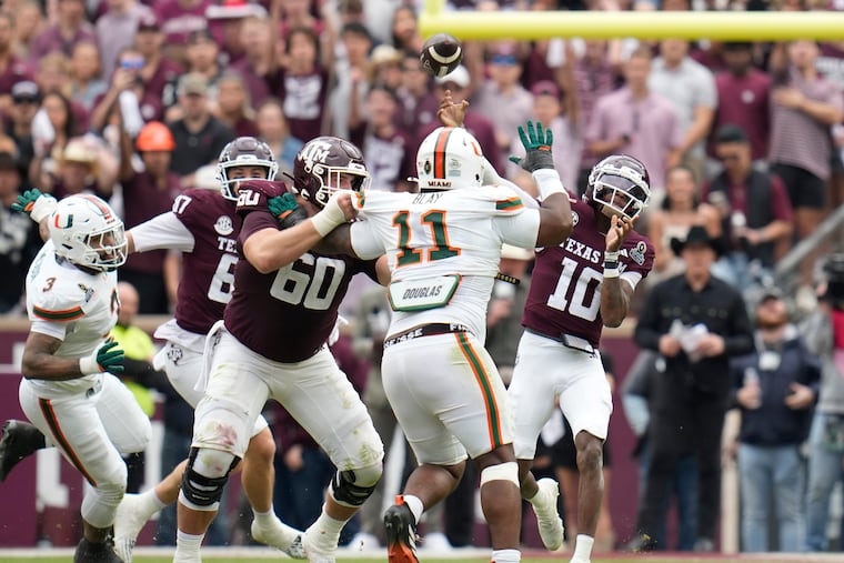 Miami defensive lineman David Blay (11) pursues Texas A&M quarterback Marcel Reed during the first round of the College Football Playoff on Dec. 20 in College Station, Texas.