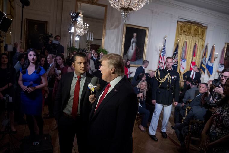 President Donald Trump appears with "Fox & Friends" co-host Pete Hegseth at a Wounded Warrior Project Soldier Ride event in the East Room of the White House on Thursday, April 6, 2017.