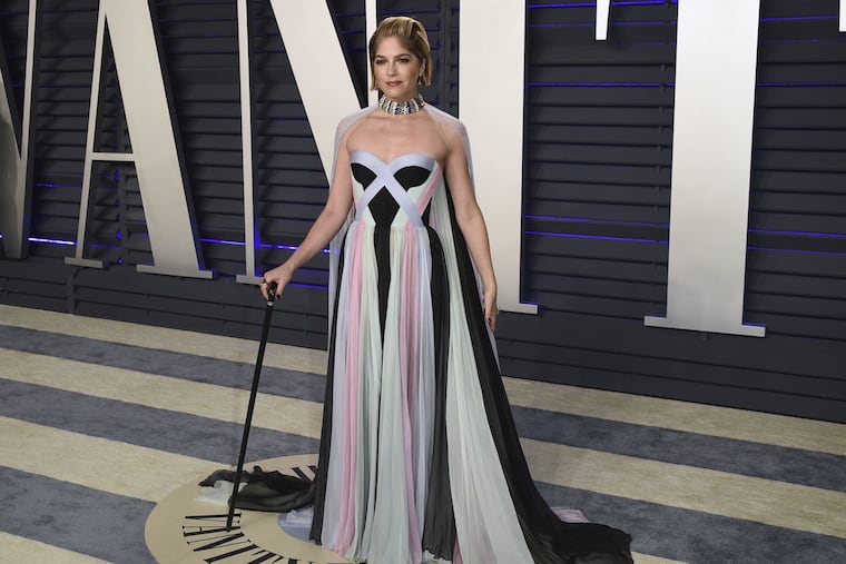 Selma Blair arrives at the Vanity Fair Oscar party Sunday in Beverly Hills, Calif., supporting herself with a cane.