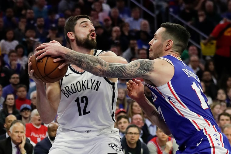 Sixers guard JJ Redick defending Nets forward Joe Harris in Game 2.