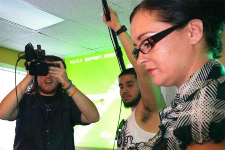 Actress Jo Anna Van Thuyne plays the secretary in "Paperboy 3: The Hard Way" as cameraman Kieran Fallon and sound man Wil Rivera capture the action.