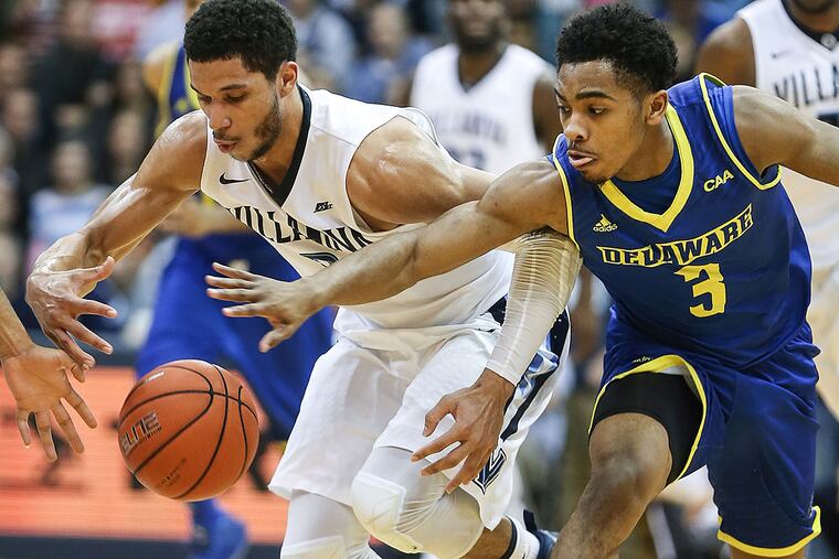 Villanova's Kris Jenkins tries for the loose ball with Delaware's Anthony Mosley.