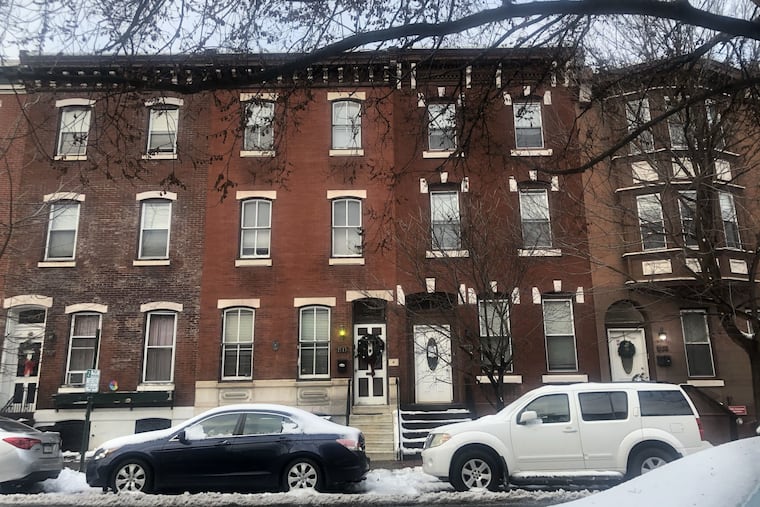 Stamm Development Group plans to demolish the house with the keystones and white door at 1513 Christian St. and insert a new, taller building in its place. Julian Abele's house is the house on the left, with the Christmas wreath.