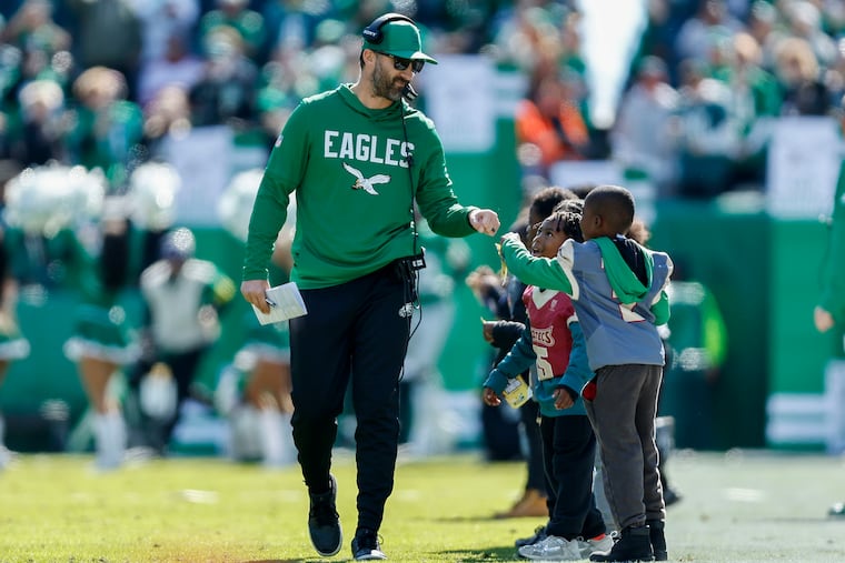 Eagles coach Nick Sirianni fist-bumps some young football players before a recent game, but the Birds didn't trade for any of them at the deadline.