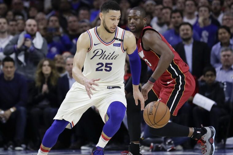 Sixers guard Ben Simmons dribbles against Miami Heat guard Dwyane Wade during game two of the Eastern Conference quarterfinals on Monday.