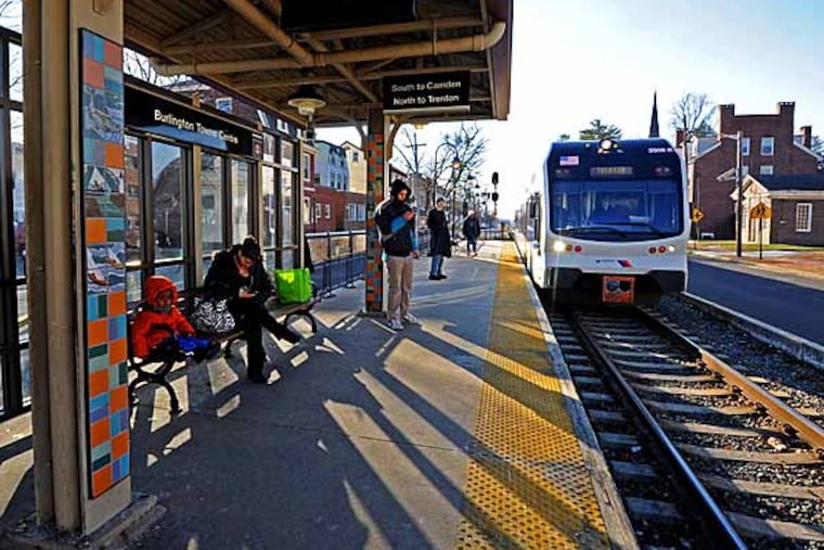 Folks wait for the Riverline light rail at Burlington Towne Centre station in Burlington City, NJ on Jan. 3, 2013. APRIL SAUL / Staff Photographer
