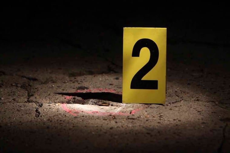 File photo of a crime scene marker and a shell casing.
