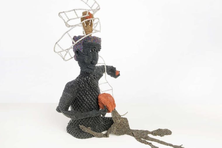 Joyce J. Scott’s “Buddha Gives Basketball to the Ghetto”; (1991), part of a retrospective at Grounds for Sculpture in Hamilton, N.J. (Collection of Carol Cole Levin)