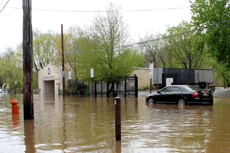 Main Street in Manayunk remained flooded Thursday.