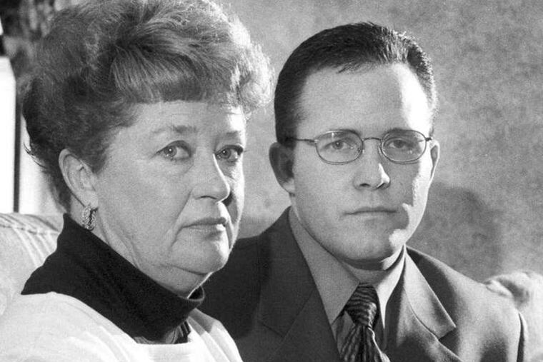 Diane Dodd , with son Casey Sherman, holds a picture of her sister Mary Sullivan, believed to be the Boston Strangler's last victim. DNA linked her killing to DeSalvo. GREG DERR / Patriot Ledger, File