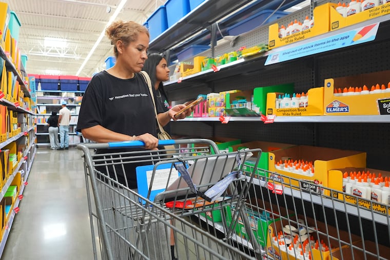Dora Diaz (left) and her daughter Fernanda Diaz, 14, shop for school supplies at a Walmart in Dallas.