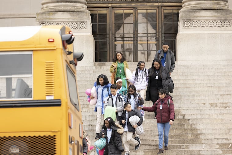 "Abbott Elementary" actors Quinta Brunson and Tyler James Wiliams at the Franklin Institute. Three Philly students from Elkins Park and Myers Elementary were featured as extras on the episode.