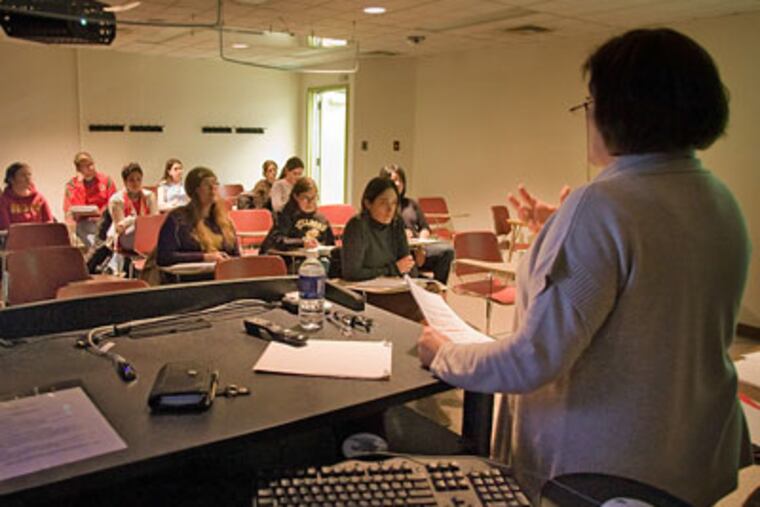 Susan Davis teaches a library-science class at Drexel, where enrollment in the program has grown more than threefold since 2000. Retirements are opening jobs for librarians. (David M. Warren / Staff Photographer)