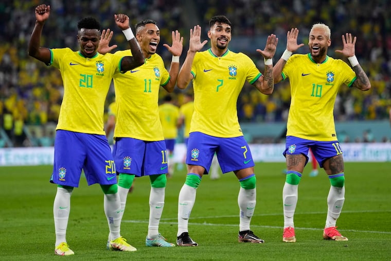 Brazil's Vinícius Junior, Raphina, Lucas Paquetá and Neymar (from left to right) celebrate after one of their team's goals against South Korea.