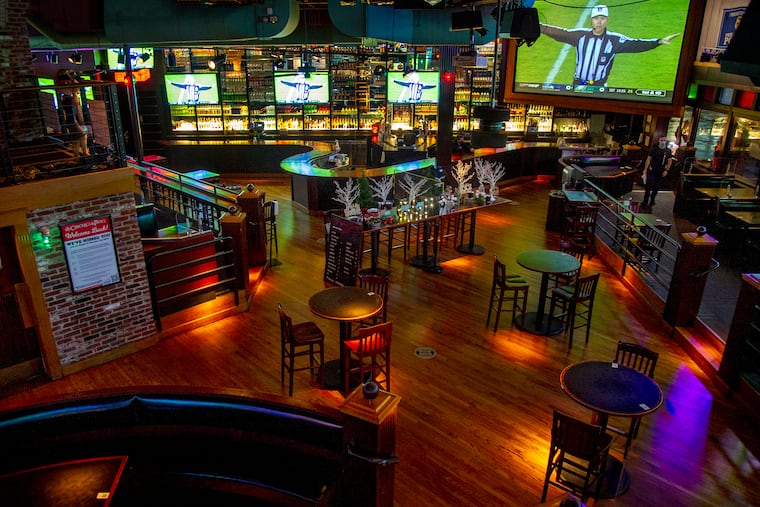 The normally packed Chickie & Pete's sports bar and restaurant in South Philadelphia is empty during an Eagles game, since the city instituted a ban on indoor dining.