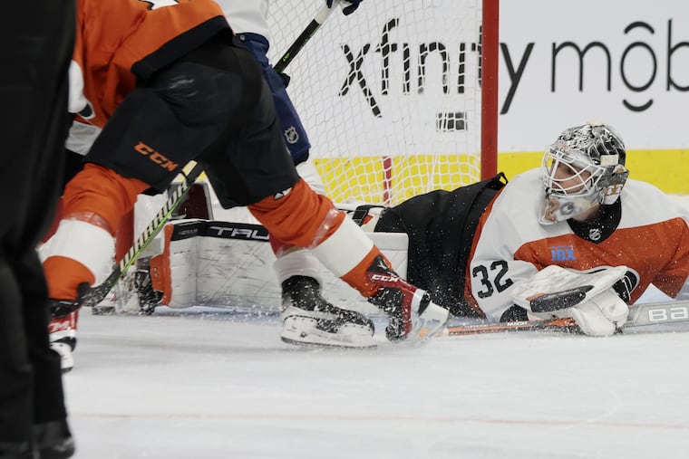 Flyers goalie Felix Sandstrom comes up with a save during a flurry of Panthers shots in the second period Sunday.