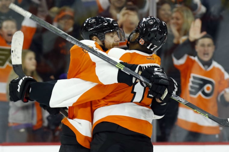 Jake Voracek celebrates a game-winning goal earlier in the season with his friend and teammate Wayne Simmonds, who both will play their 500th career NHL game tonight.