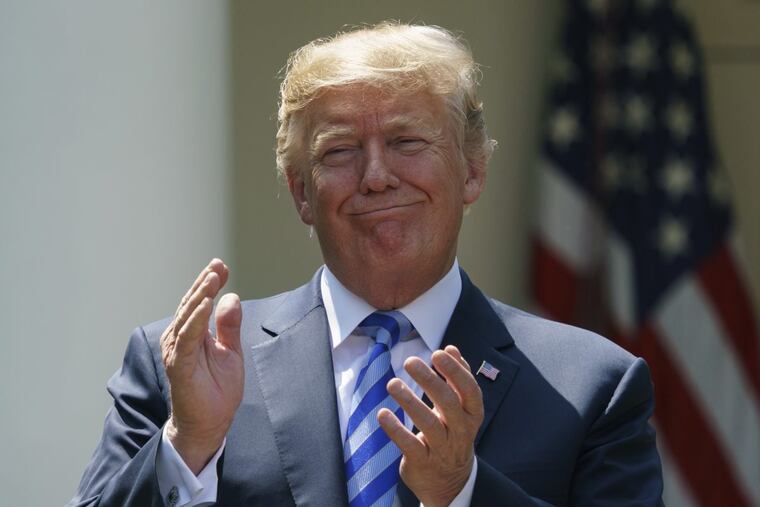President Trump applauds during an event about prescription drug prices with Health and Human Services Secretary Alex Azar in the Rose Garden of the White House in Washington, Friday, May 11, 2018.