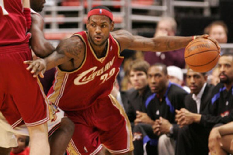 Cleveland's LeBron James is used to having the ball in his hands. Coach Mike Brown left the offense up to him and concentrated on defense last season. This season, a new system is in place.