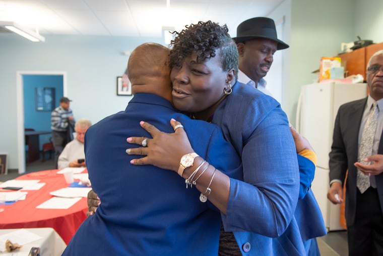 Roni Green embraces 44th Ward Leader Willie Jordan after being nominated to run in the February 25th special election for the 190th District of the state house in West Philadelphia. (Jonathan Wilson / For the Inquirer)