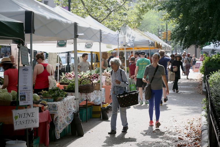 People shop at the Rittenhouse Farmers' Market in Philadelphia's Rittenhouse Square on Saturday, July 6, 2019.