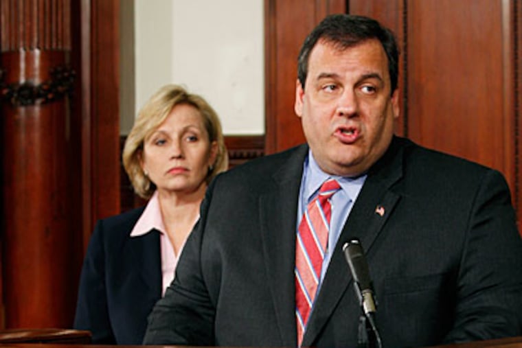 Lt. Gov. Kim Guadagno looks on as Republican New Jersey Gov. Chris Christie answers a question after he signed an executive order Tuesday, Feb. 23, 2010, in Trenton, N.J., that bans state agencies from hiring lobbyists to lobby the state . (AP Photo/Mel Evans)