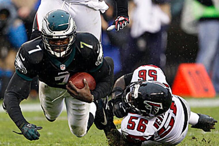 "I'm giving us every opportunity to win. I'm trying my hardest," Michael Vick said after Sunday's loss to the Falcons. (Yong Kim/Staff Photographer)