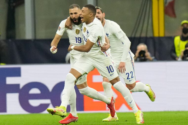 Karim Benzema (left) and Kylian Mbappé lead reigning champion France's defense of its World Cup title.