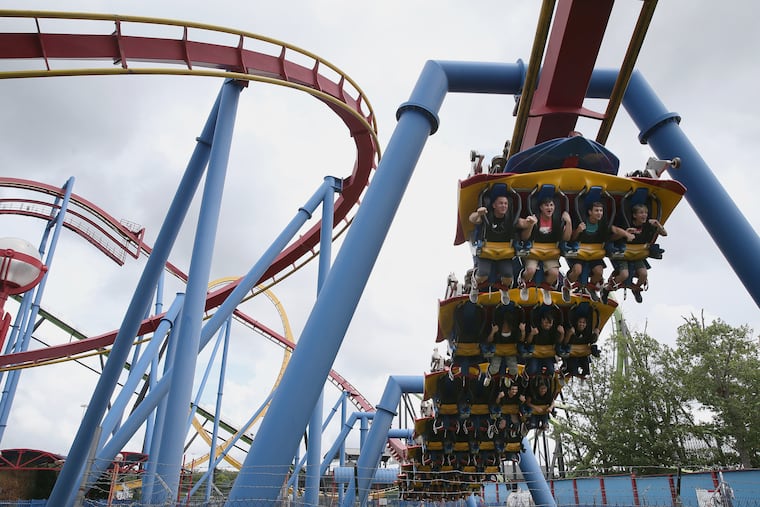People ride the Superman roller coaster at Six Flags Great Adventure in Jackson, N.J., on Tuesday, July 24, 2018.