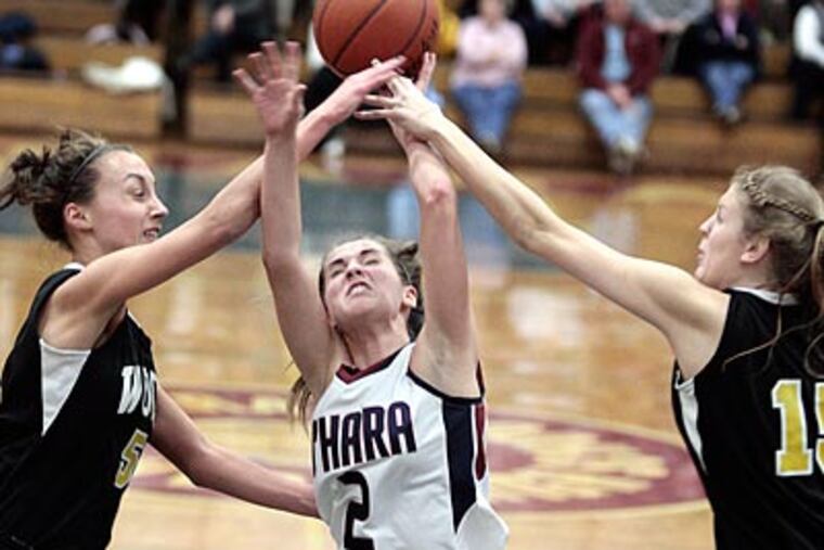 O'Hara's Mackenzie Rule is fouled by Wood's Grace Mirack (left) and Lauren Nealon. (Elizabeth Robertson/Staff Photographer)