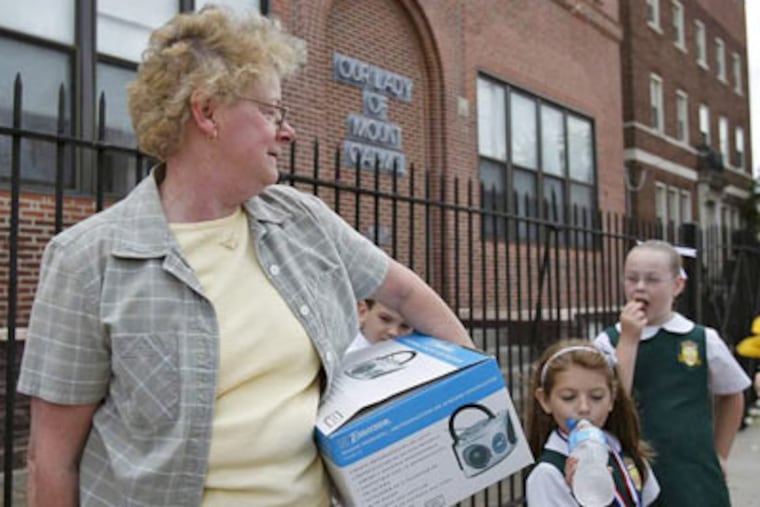 Teacher Joan Weeney leaves Our Lady of Mount Carmel, where she has taught for 35 years. DAVID MAIALETTI / Staff Photographer