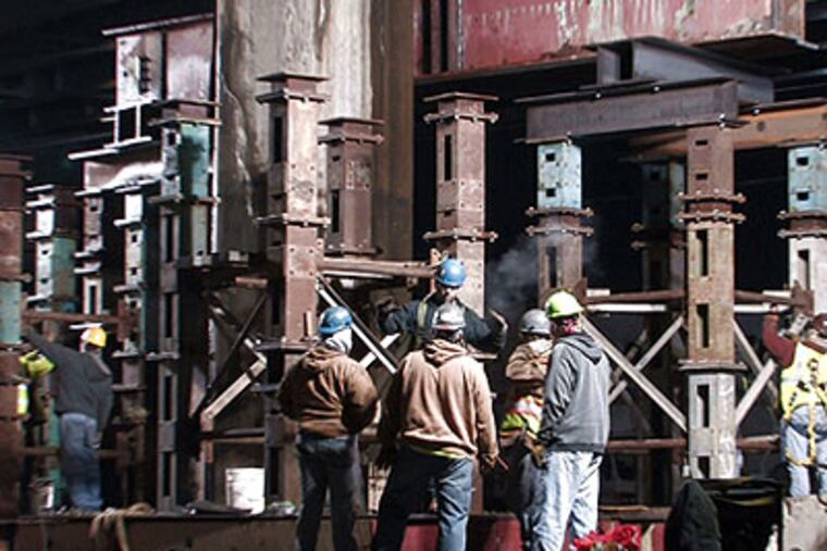 Workers make emergency repairs in 2008 to a support of I-95 between Ann and Cambria Streets in Philadelphia. (File photo: David Swanson / Staff Photographer)