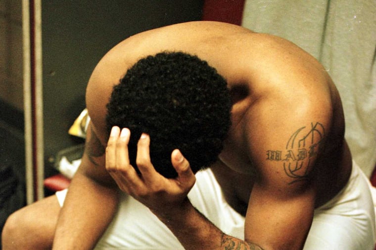 Temple's Quincy Wadley in the locker room in Buffalo, N.Y. after the Owls were upset in the second round by Seton Hall in 2000.