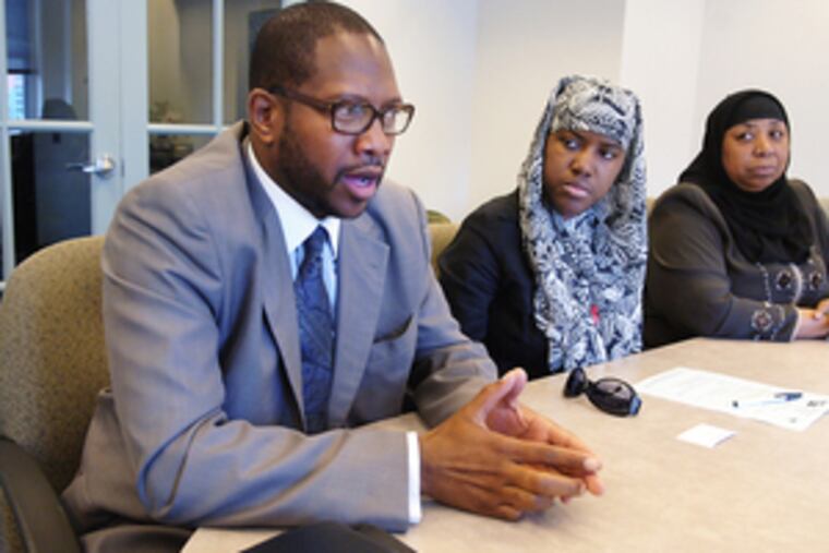 American Muslim leaders speak about problems they face. From left, they are Amin Nathari of Islam in America, Aliya Khabir of AZK Communications, and Rashidah Abdul Khabeer, a nurse and educator.
