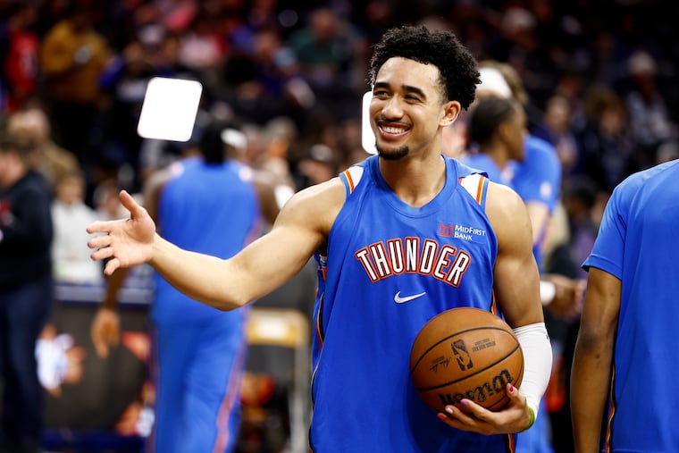 Oklahoma City Thunder guard Jared McCain greets old friends before his new team beat the Sixers on Monday.